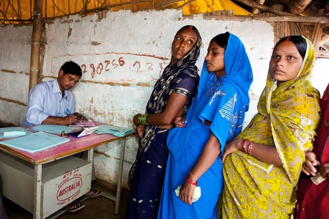 Pregnant Indian women queueing for pregnancy test